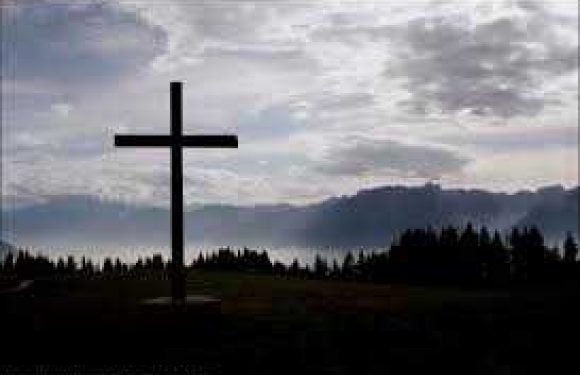 Cross with Mountains & tress in the background