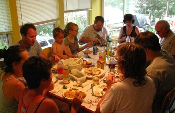 Family praying before a meal
