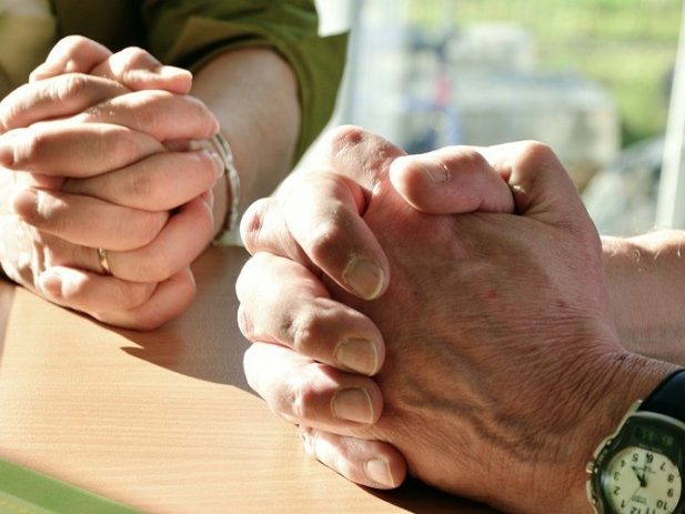 folder hands in prayer